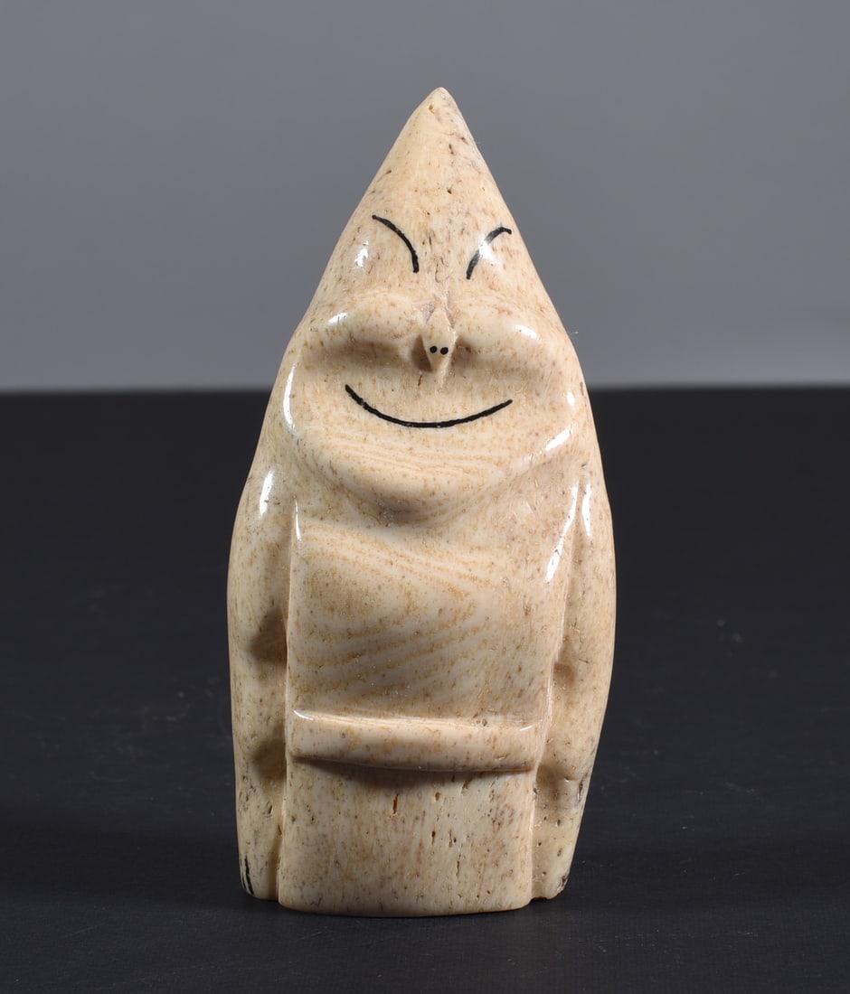Inuit Carved Whale Bone Figure: These bone carvings were found in an attic trunk wrapped in 1960s newspaper. The collection came straight from the attic to our gallery and we unwrapped and photoed. All of these are small under 7". W