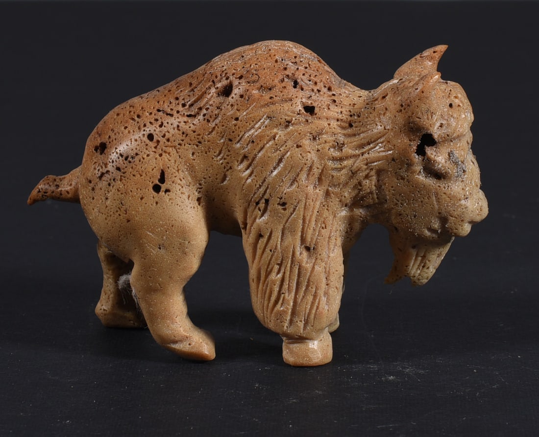 Inuit Carved Whale Bone Figure: These bone carvings were found in an attic trunk wrapped in 1960s newspaper. The collection came straight from the attic to our gallery and we unwrapped and photoed. All of these are small under 7". W