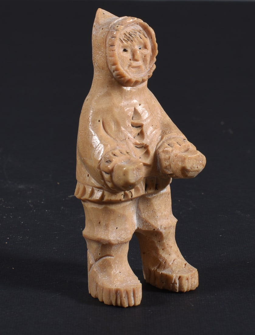 Inuit Carved Whale Bone Figure: These bone carvings were found in an attic trunk wrapped in 1960s newspaper. The collection came straight from the attic to our gallery and we unwrapped and photoed. All of these are small under 7". W