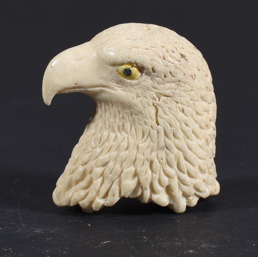 Inuit Carved Whale Bone Figure: These bone carvings were found in an attic trunk wrapped in 1960s newspaper. The collection came straight from the attic to our gallery and we unwrapped and photoed. All of these are small under 7". W