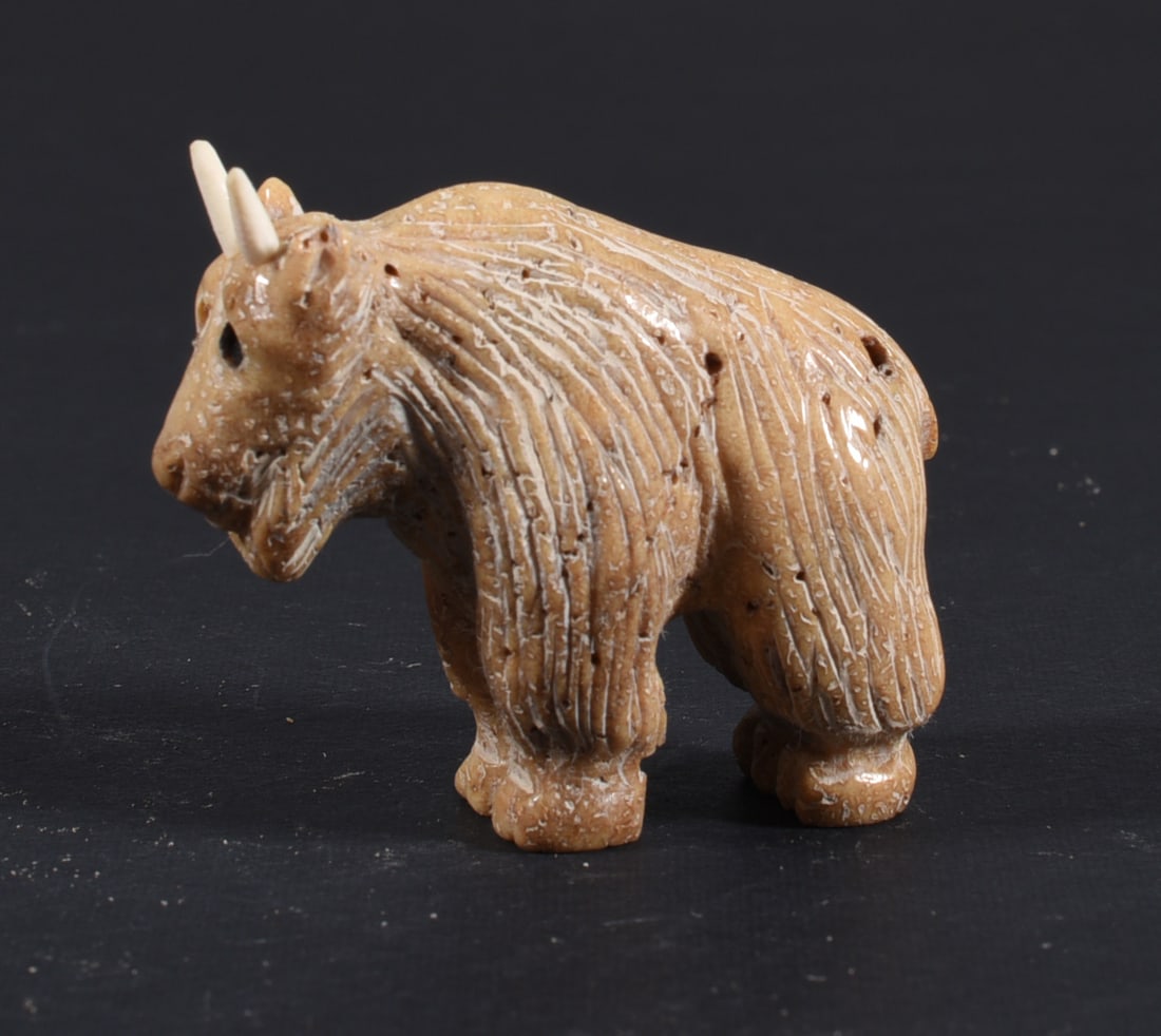 Inuit Carved Whale Bone Figure: These bone carvings were found in an attic trunk wrapped in 1960s newspaper. The collection came straight from the attic to our gallery and we unwrapped and photoed. All of these are small under 7". W