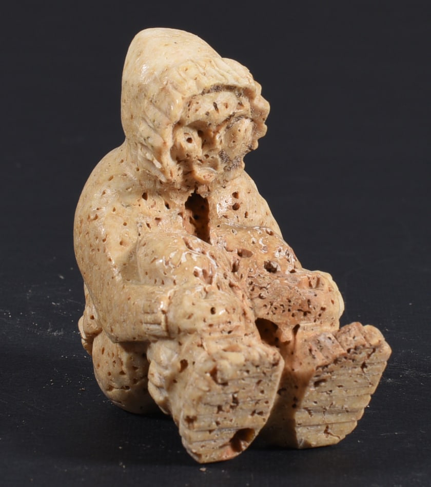 Inuit Carved Whale Bone Figure: These bone carvings were found in an attic trunk wrapped in 1960s newspaper. The collection came straight from the attic to our gallery and we unwrapped and photoed. All of these are small under 7". W