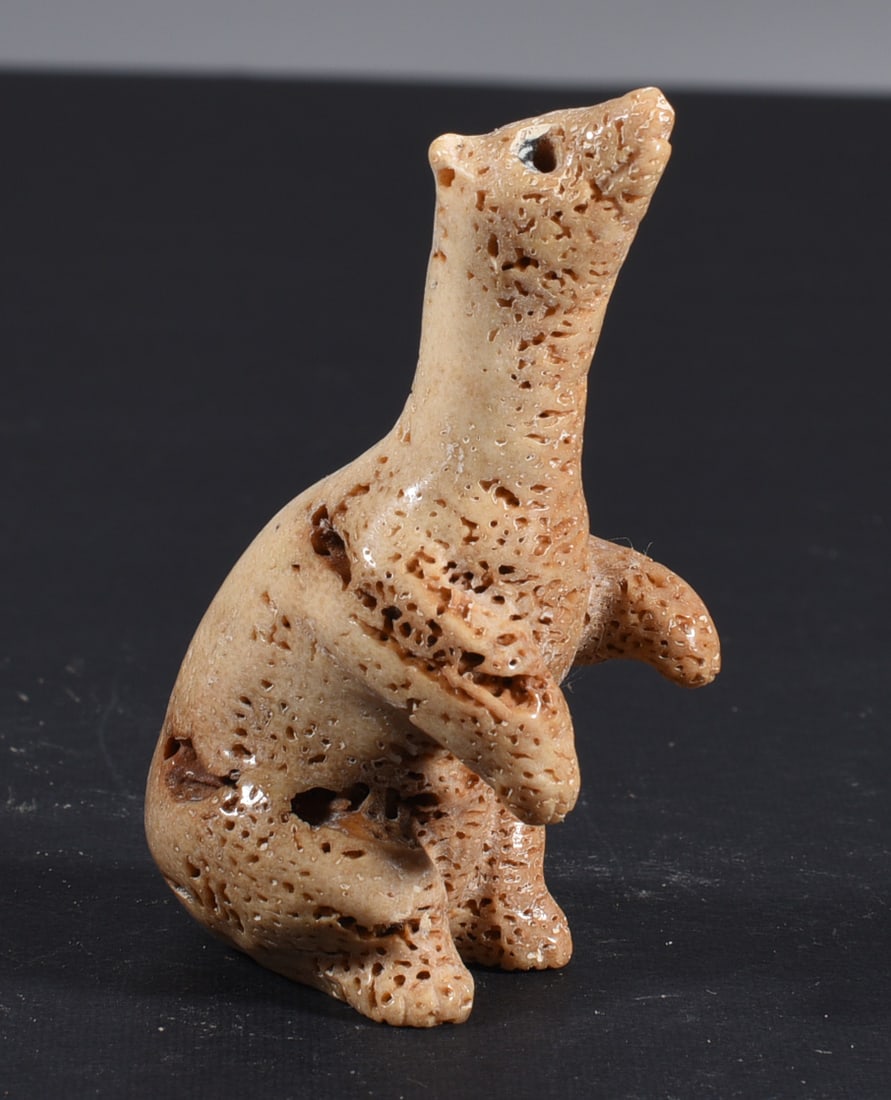Inuit Carved Whale Bone Figure: These bone carvings were found in an attic trunk wrapped in 1960s newspaper. The collection came straight from the attic to our gallery and we unwrapped and photoed. All of these are small under 7". W