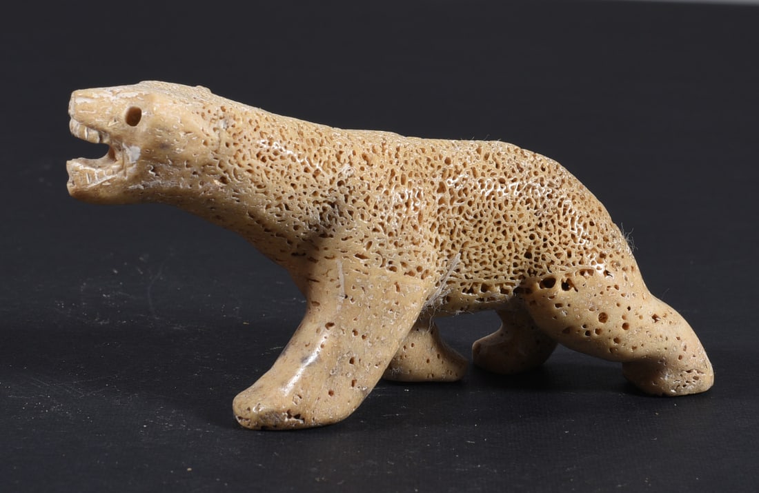 Inuit Carved Whale Bone Figure: These bone carvings were found in an attic trunk wrapped in 1960s newspaper. The collection came straight from the attic to our gallery and we unwrapped and photoed. All of these are small under 7". W