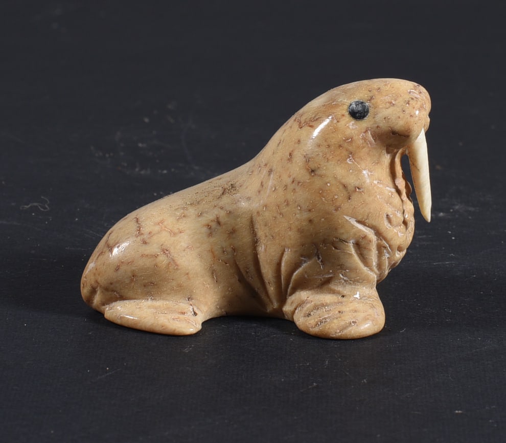 Inuit Carved Whale Bone Figure: These bone carvings were found in an attic trunk wrapped in 1960s newspaper. The collection came straight from the attic to our gallery and we unwrapped and photoed. All of these are small under 7". W