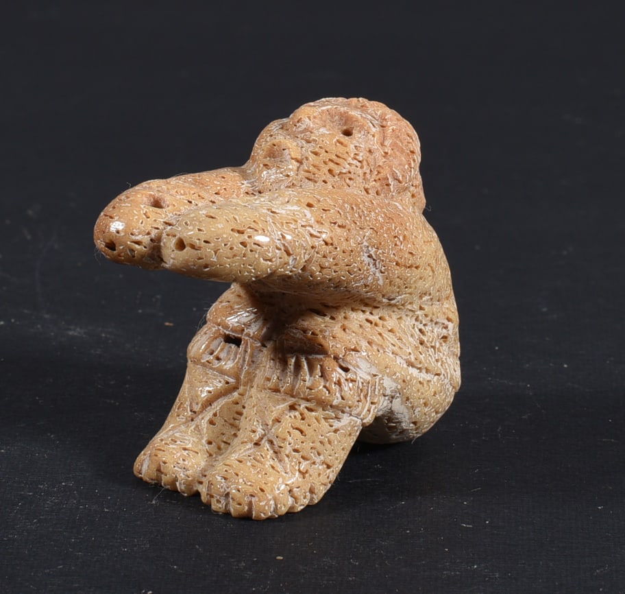 Inuit Carved Whale Bone Figure: These bone carvings were found in an attic trunk wrapped in 1960s newspaper. The collection came straight from the attic to our gallery and we unwrapped and photoed. All of these are small under 7". W