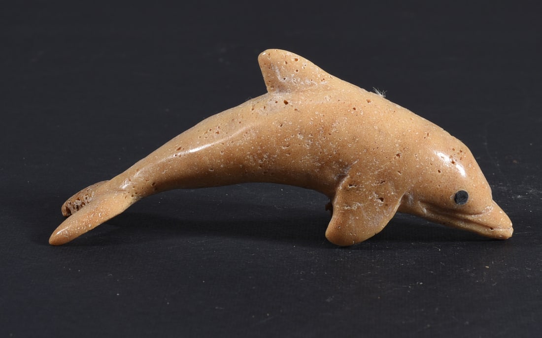 Inuit Carved Whale Bone Figure: These bone carvings were found in an attic trunk wrapped in 1960s newspaper. The collection came straight from the attic to our gallery and we unwrapped and photoed. All of these are small under 7". W