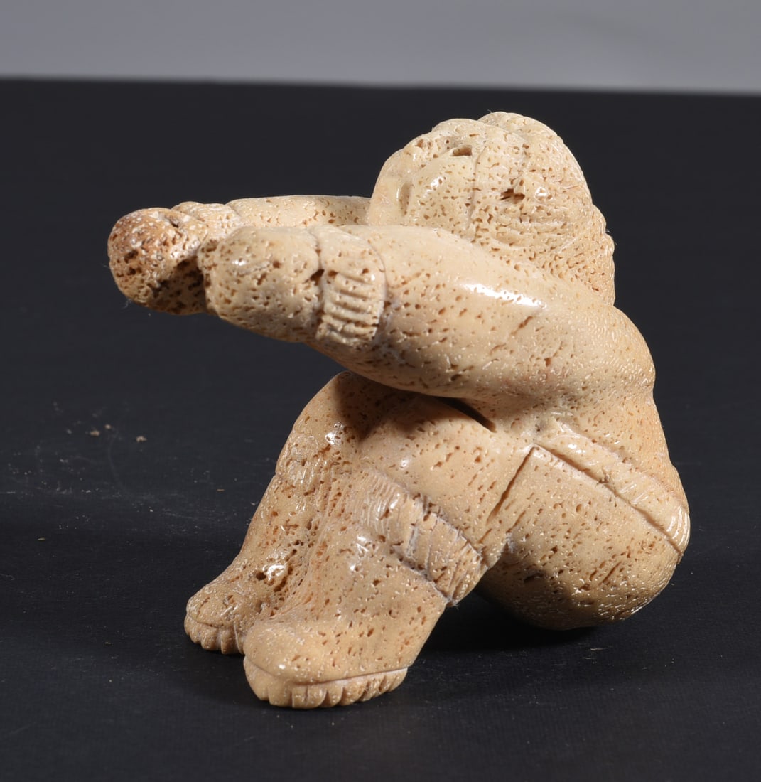 Inuit Carved Whale Bone Figure: These bone carvings were found in an attic trunk wrapped in 1960s newspaper. The collection came straight from the attic to our gallery and we unwrapped and photoed. All of these are small under 7". W