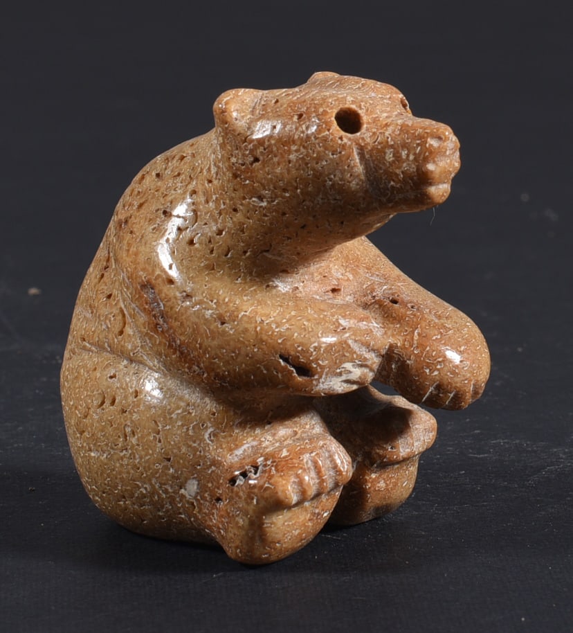 Inuit Carved Whale Bone Figure: These bone carvings were found in an attic trunk wrapped in 1960s newspaper. The collection came straight from the attic to our gallery and we unwrapped and photoed. All of these are small under 7". W