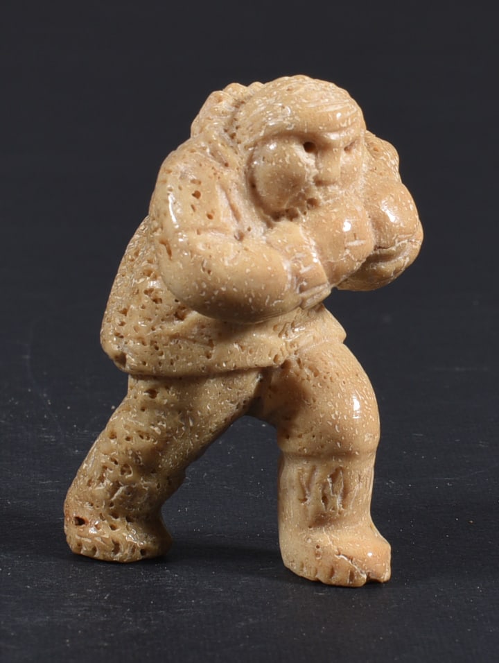 Inuit Carved Whale Bone Figure: These bone carvings were found in an attic trunk wrapped in 1960s newspaper. The collection came straight from the attic to our gallery and we unwrapped and photoed. All of these are small under 7". W