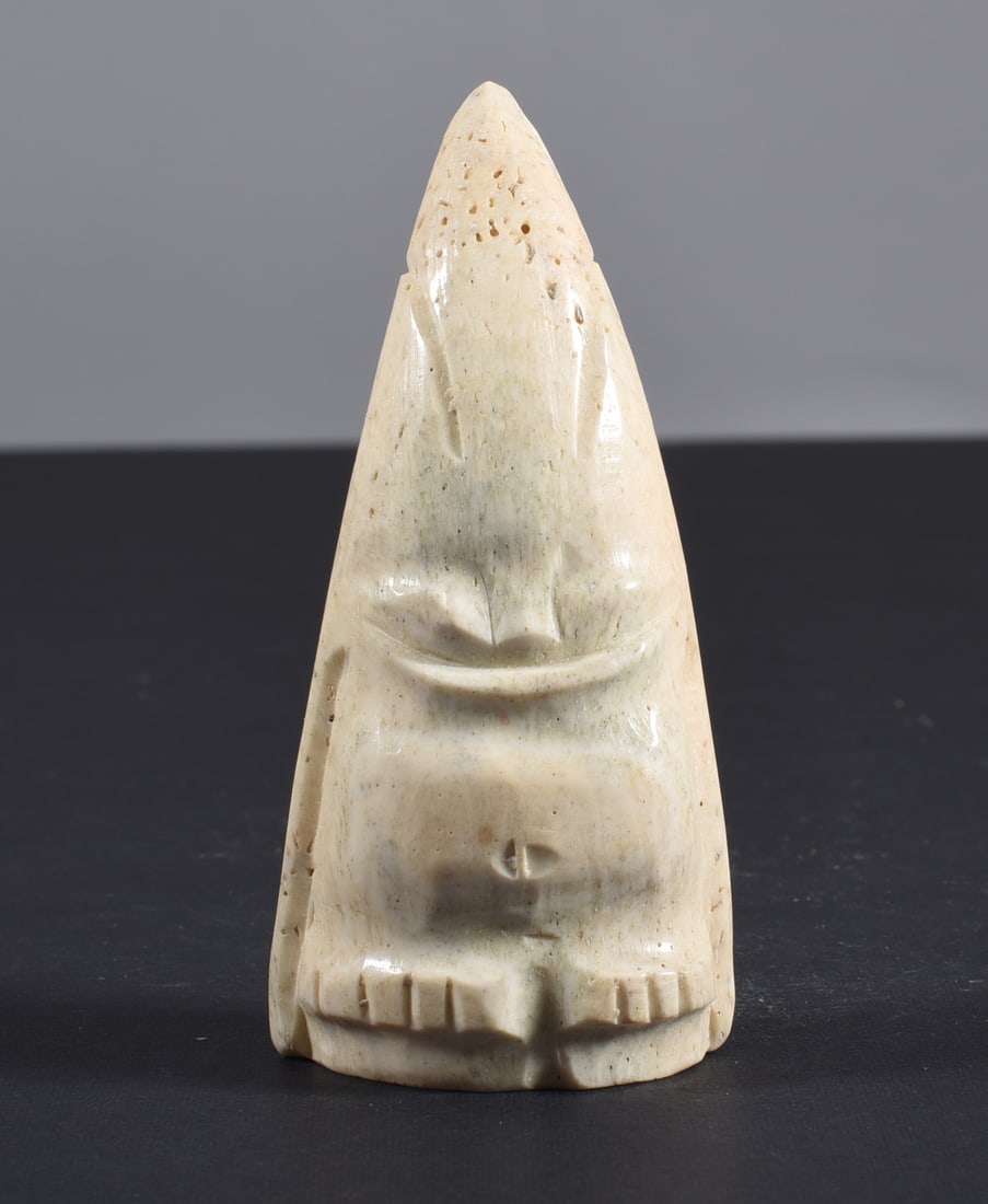 Inuit Carved Whale Bone Figure: These bone carvings were found in an attic trunk wrapped in 1960s newspaper. The collection came straight from the attic to our gallery and we unwrapped and photoed. All of these are small under 7". W