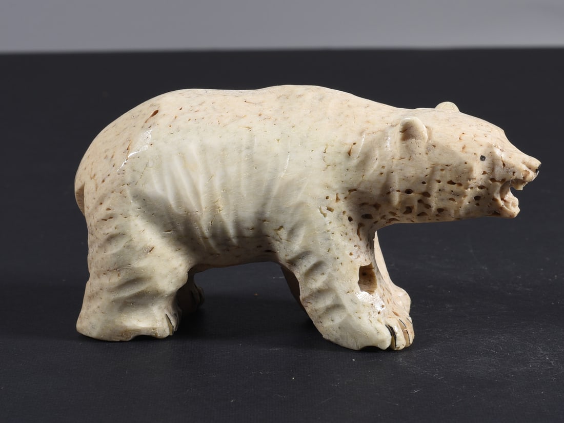 Inuit Carved Whale Bone Figure: These bone carvings were found in an attic trunk wrapped in 1960s newspaper. The collection came straight from the attic to our gallery and we unwrapped and photoed. All of these are small under 7". W