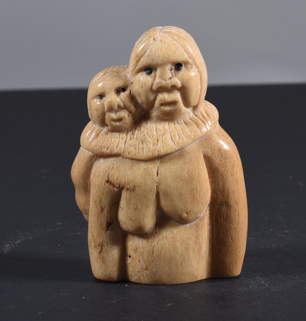 Inuit Carved Whale Bone Figure: These bone carvings were found in an attic trunk wrapped in 1960s newspaper. The collection came straight from the attic to our gallery and we unwrapped and photoed. All of these are small under 7". W