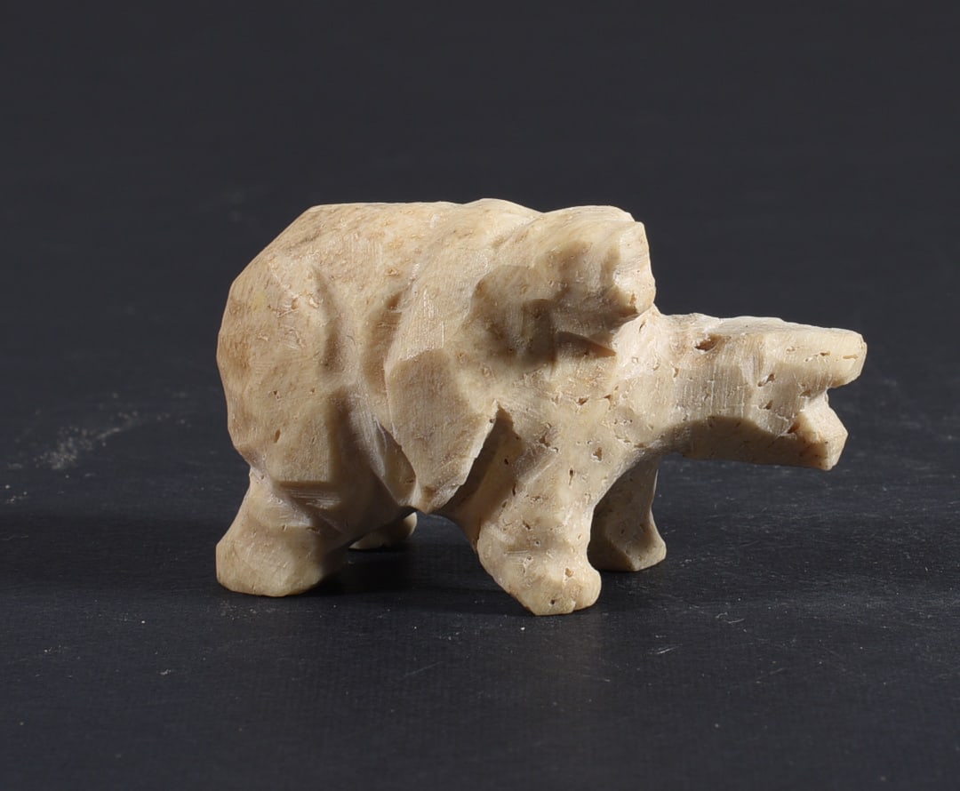 Inuit Carved Whale Bone Figure: These bone carvings were found in an attic trunk wrapped in 1960s newspaper. The collection came straight from the attic to our gallery and we unwrapped and photoed. All of these are small under 7". W