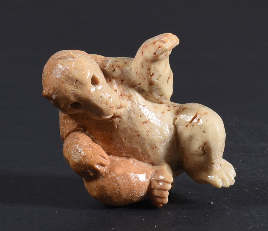 Inuit Carved Whale Bone Figure: These bone carvings were found in an attic trunk wrapped in 1960s newspaper. The collection came straight from the attic to our gallery and we unwrapped and photoed. All of these are small under 7". W