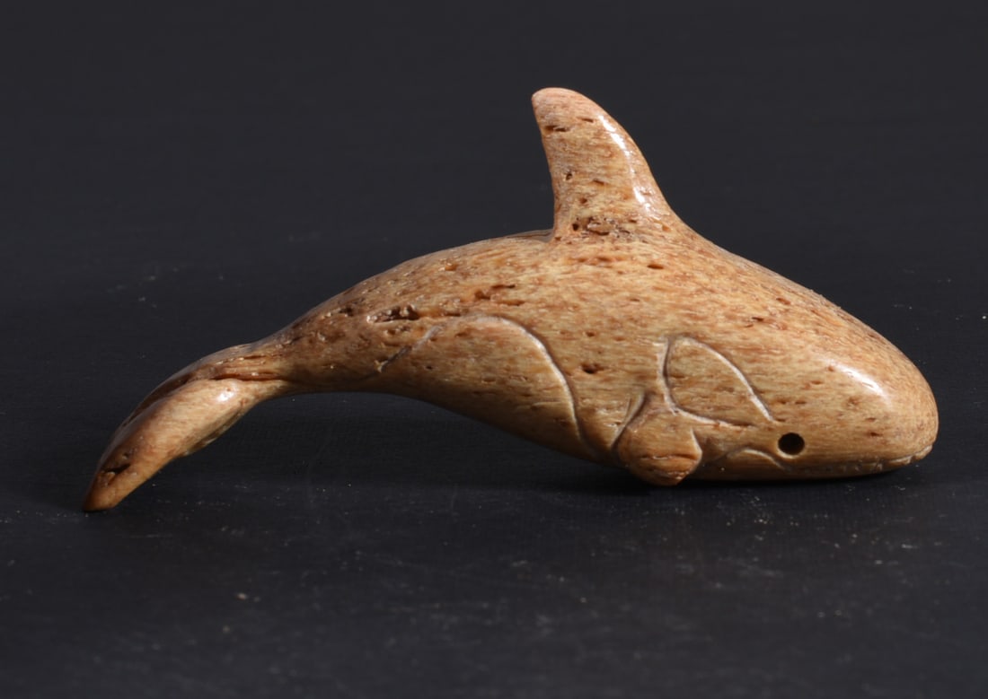 Inuit Carved Whale Bone Figure: These bone carvings were found in an attic trunk wrapped in 1960s newspaper. The collection came straight from the attic to our gallery and we unwrapped and photoed. All of these are small under 7". W