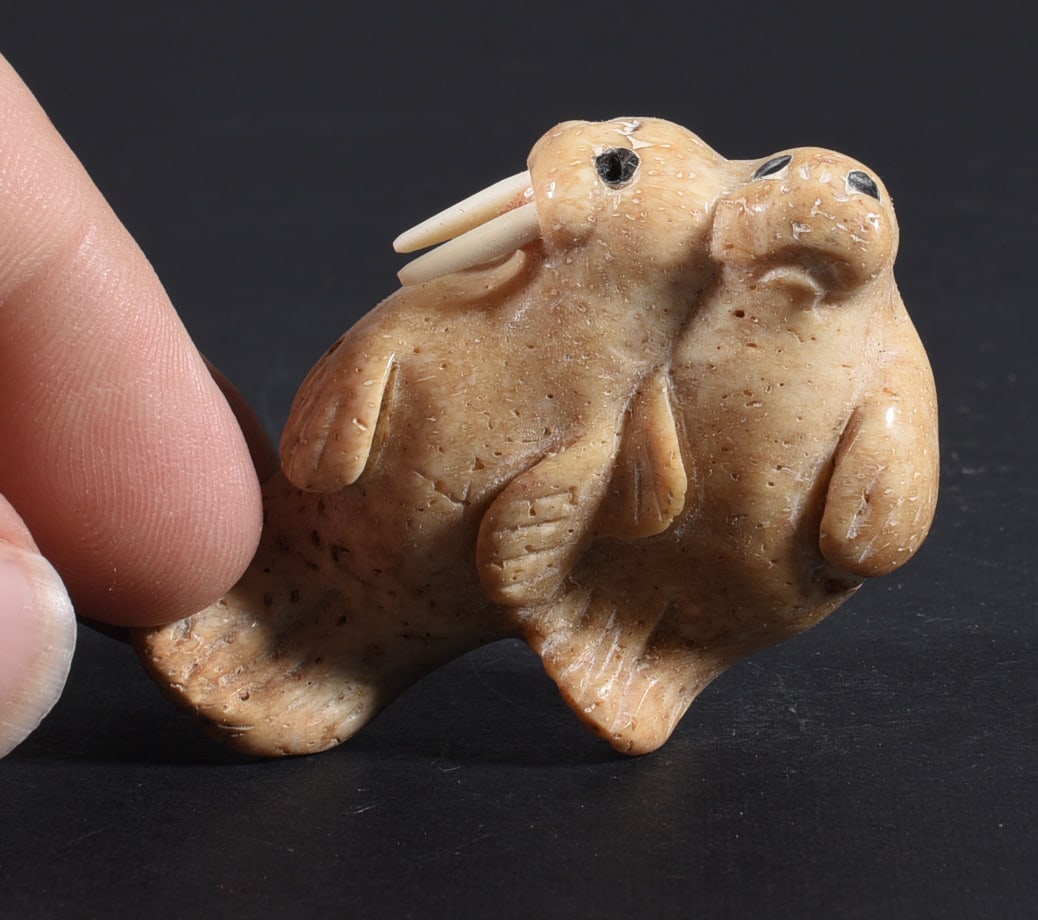 Inuit Carved Whale Bone Figure: These bone carvings were found in an attic trunk wrapped in 1960s newspaper. The collection came straight from the attic to our gallery and we unwrapped and photoed. All of these are small under 7". W