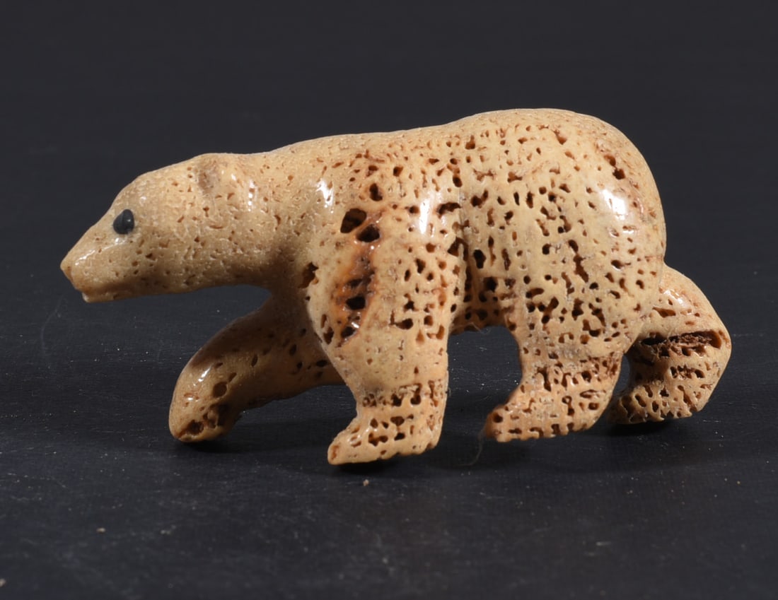 Inuit Carved Whale Bone Figure: These bone carvings were found in an attic trunk wrapped in 1960s newspaper. The collection came straight from the attic to our gallery and we unwrapped and photoed. All of these are small under 7". W