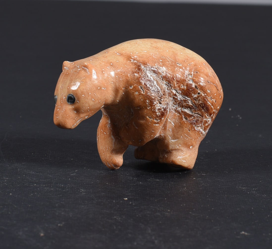 Inuit Carved Whale Bone Figure: These bone carvings were found in an attic trunk wrapped in 1960s newspaper. The collection came straight from the attic to our gallery and we unwrapped and photoed. All of these are small under 7". W