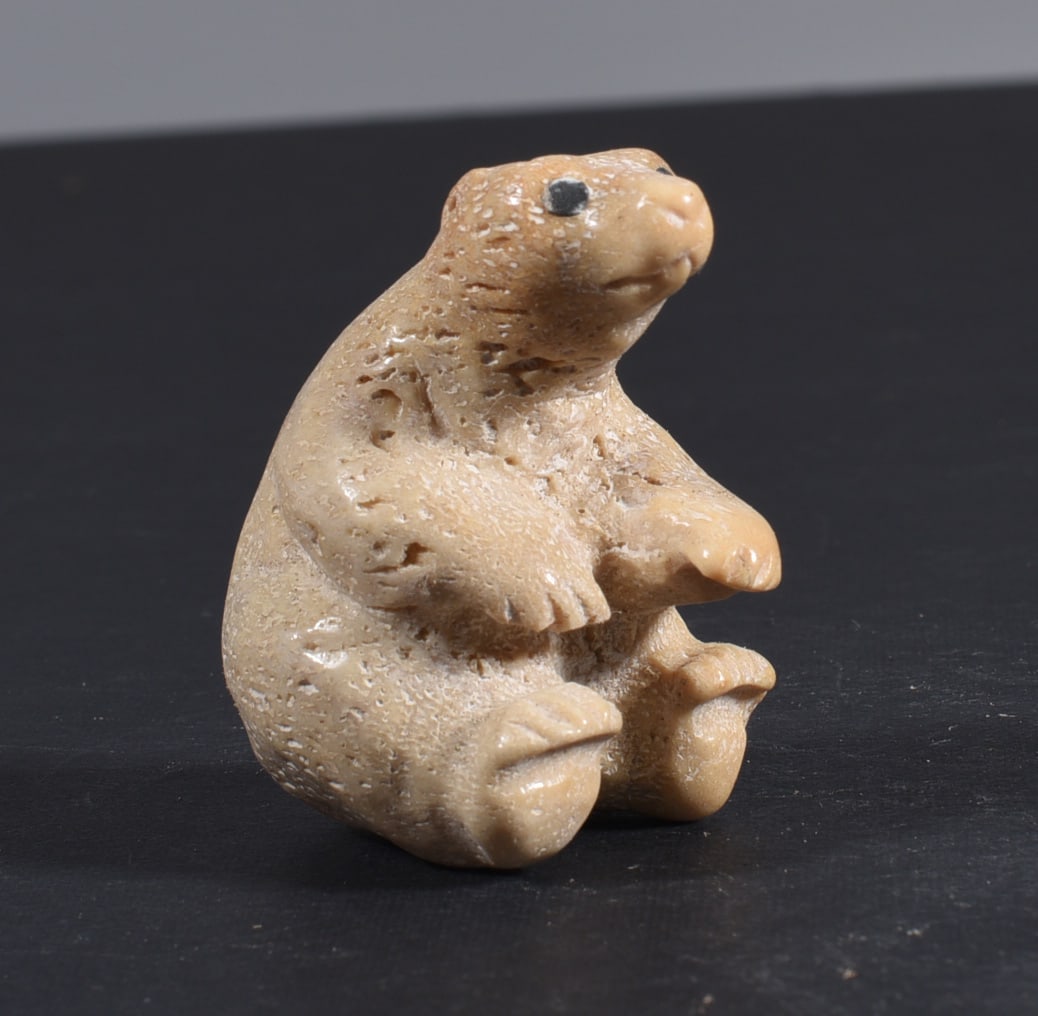 Inuit Carved Whale Bone Figure: These bone carvings were found in an attic trunk wrapped in 1960s newspaper. The collection came straight from the attic to our gallery and we unwrapped and photoed. All of these are small under 7". W