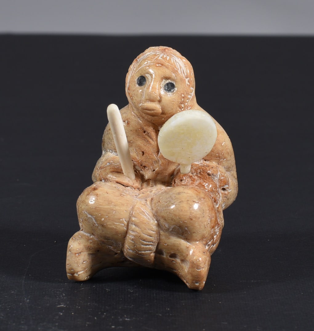 Inuit Carved Whale Bone Figure: These bone carvings were found in an attic trunk wrapped in 1960s newspaper. The collection came straight from the attic to our gallery and we unwrapped and photoed. All of these are small under 7". W