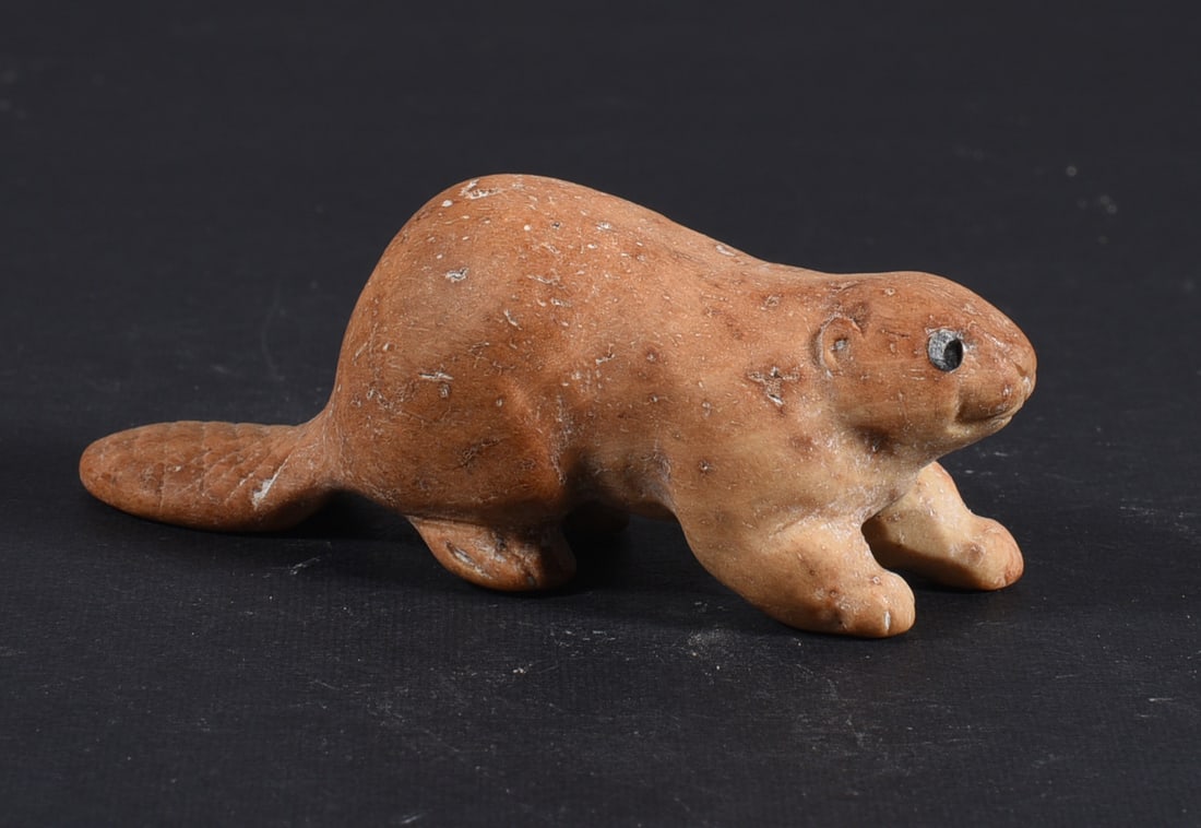 Inuit Carved Whale Bone Figure: These bone carvings were found in an attic trunk wrapped in 1960s newspaper. The collection came straight from the attic to our gallery and we unwrapped and photoed. All of these are small under 7". W