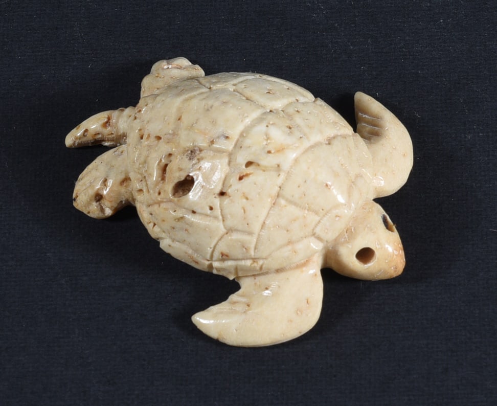 Inuit Carved Whale Bone Figure: These bone carvings were found in an attic trunk wrapped in 1960s newspaper. The collection came straight from the attic to our gallery and we unwrapped and photoed. All of these are small under 7". W