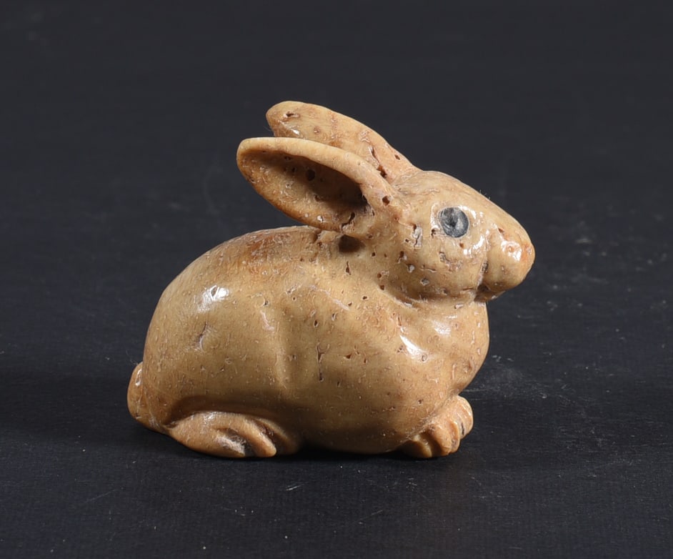 Inuit Carved Whale Bone Figure: These bone carvings were found in an attic trunk wrapped in 1960s newspaper. The collection came straight from the attic to our gallery and we unwrapped and photoed. All of these are small under 7". W