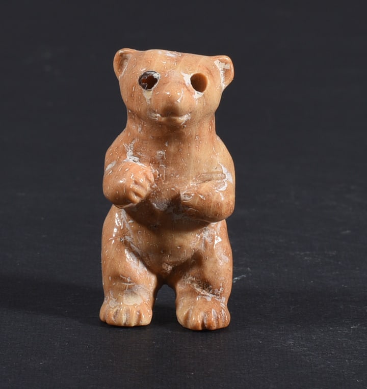 Inuit Carved Whale Bone Figure: These bone carvings were found in an attic trunk wrapped in 1960s newspaper. The collection came straight from the attic to our gallery and we unwrapped and photoed. All of these are small under 7". W