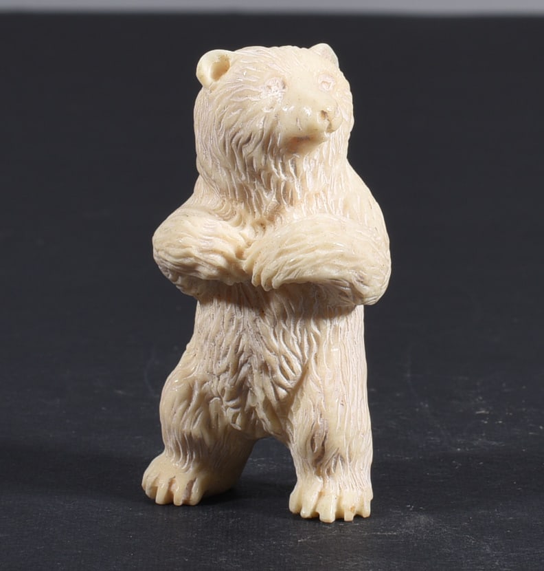 Inuit Carved Whale Bone Figure: These bone carvings were found in an attic trunk wrapped in 1960s newspaper. The collection came straight from the attic to our gallery and we unwrapped and photoed. All of these are small under 7". W