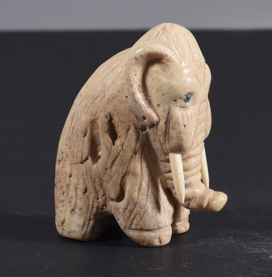 Inuit Carved Whale Bone Figure: These bone carvings were found in an attic trunk wrapped in 1960s newspaper. The collection came straight from the attic to our gallery and we unwrapped and photoed. All of these are small under 7". W
