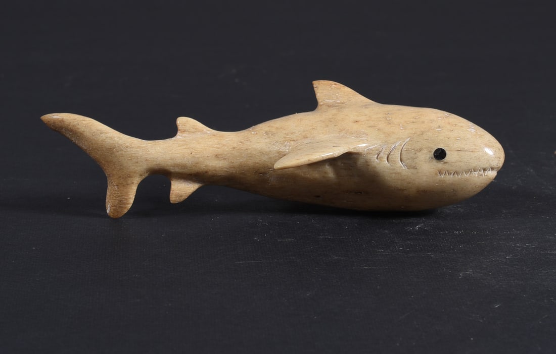 Inuit Carved Whale Bone Figure: These bone carvings were found in an attic trunk wrapped in 1960s newspaper. The collection came straight from the attic to our gallery and we unwrapped and photoed. All of these are small under 7". W