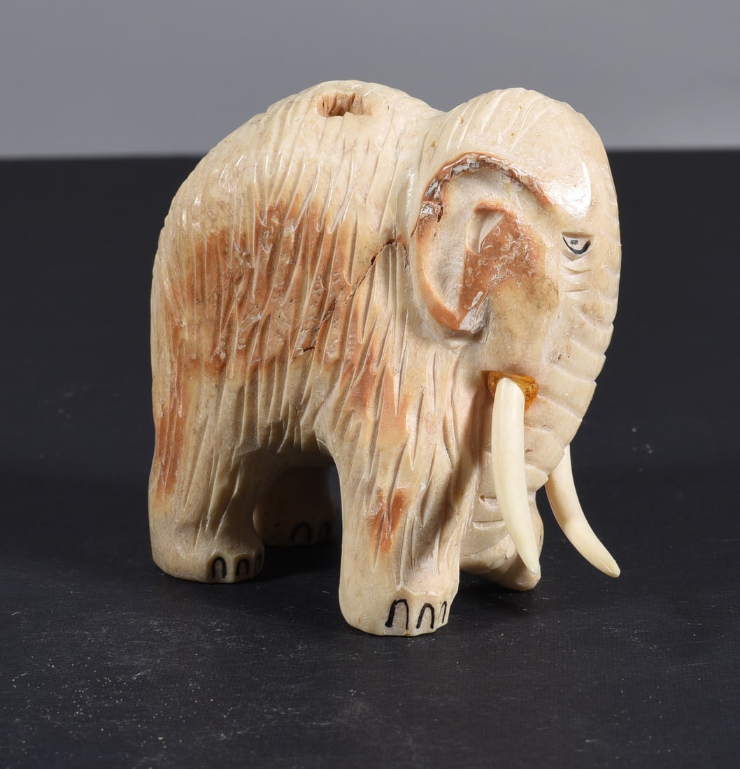 Inuit Carved Whale Bone Figure: These bone carvings were found in an attic trunk wrapped in 1960s newspaper. The collection came straight from the attic to our gallery and we unwrapped and photoed. All of these are small under 7". W