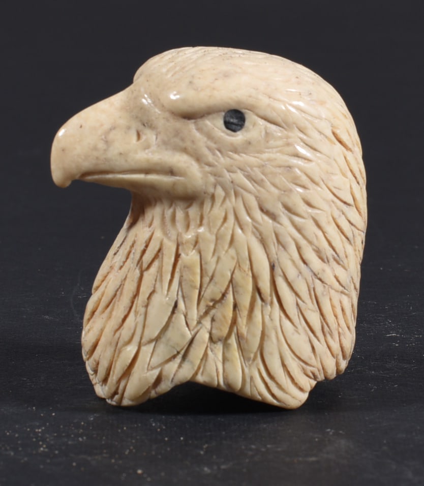 Inuit Carved Whale Bone Figure: These bone carvings were found in an attic trunk wrapped in 1960s newspaper. The collection came straight from the attic to our gallery and we unwrapped and photoed. All of these are small under 7". W