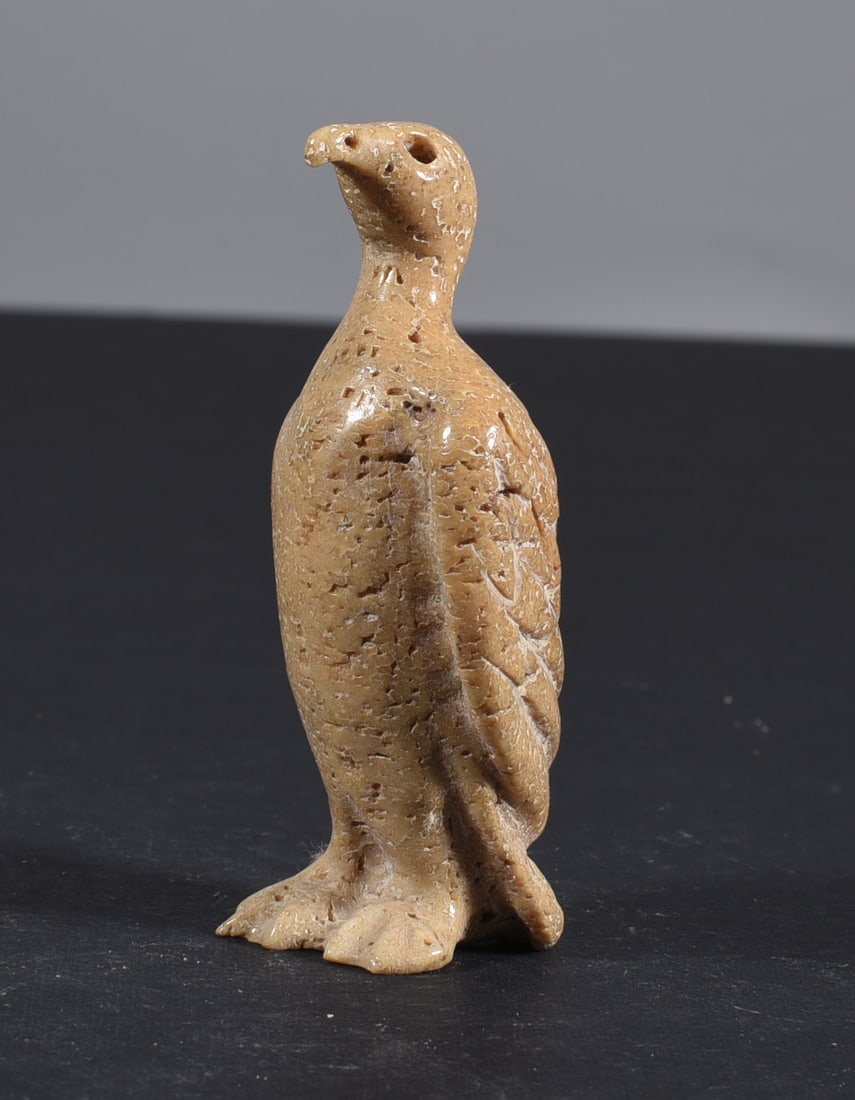 Inuit Carved Whale Bone Figure: These bone carvings were found in an attic trunk wrapped in 1960s newspaper. The collection came straight from the attic to our gallery and we unwrapped and photoed. All of these are small under 7". W