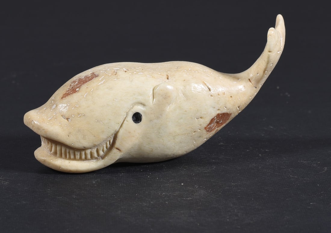 Inuit Carved Whale Bone Figure: These bone carvings were found in an attic trunk wrapped in 1960s newspaper. The collection came straight from the attic to our gallery and we unwrapped and photoed. All of these are small under 7". W