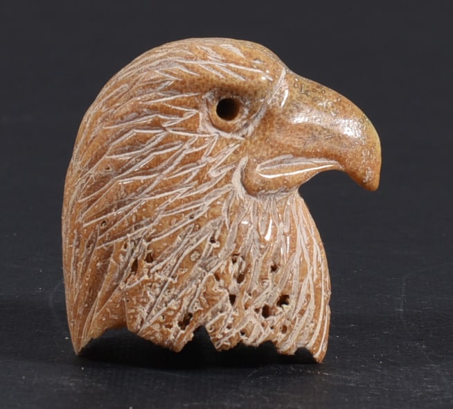 Inuit Carved Whale Bone Figure: These bone carvings were found in an attic trunk wrapped in 1960s newspaper. The collection came straight from the attic to our gallery and we unwrapped and photoed. All of these are small under 7". W