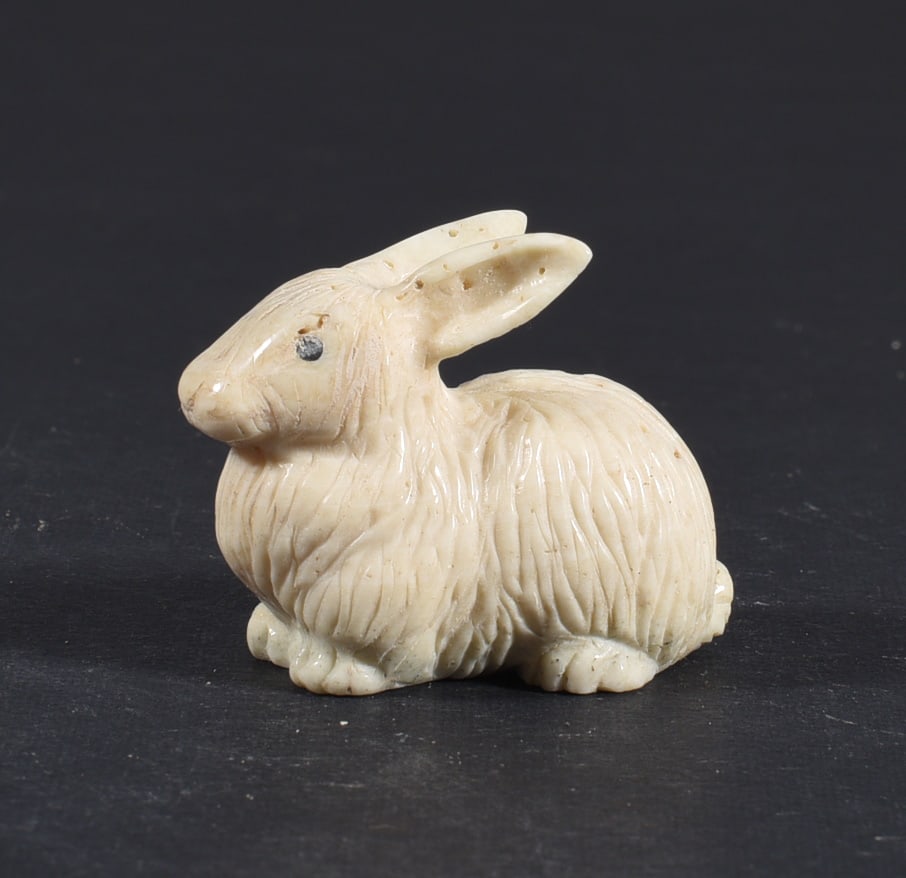 Inuit Carved Whale Bone Figure: These bone carvings were found in an attic trunk wrapped in 1960s newspaper. The collection came straight from the attic to our gallery and we unwrapped and photoed. All of these are small under 7". W