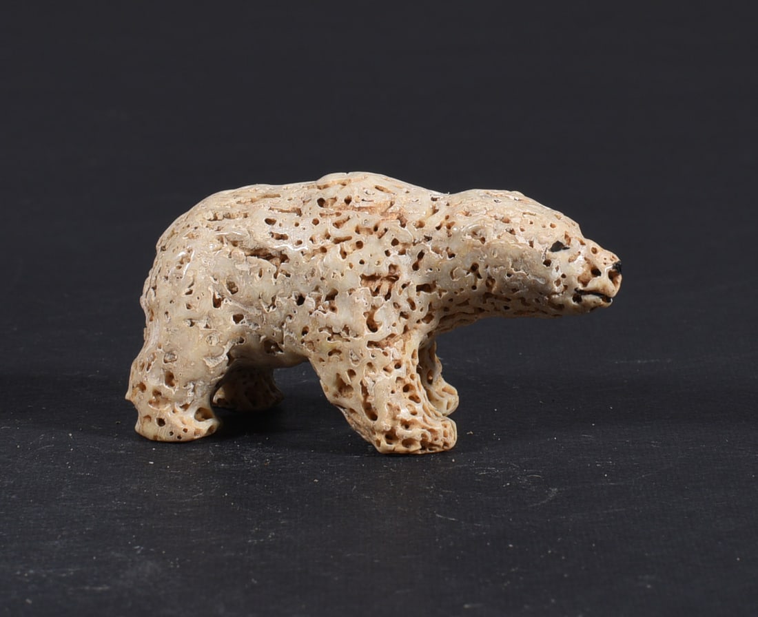 Inuit Carved Whale Bone Figure: These bone carvings were found in an attic trunk wrapped in 1960s newspaper. The collection came straight from the attic to our gallery and we unwrapped and photoed. All of these are small under 7". W