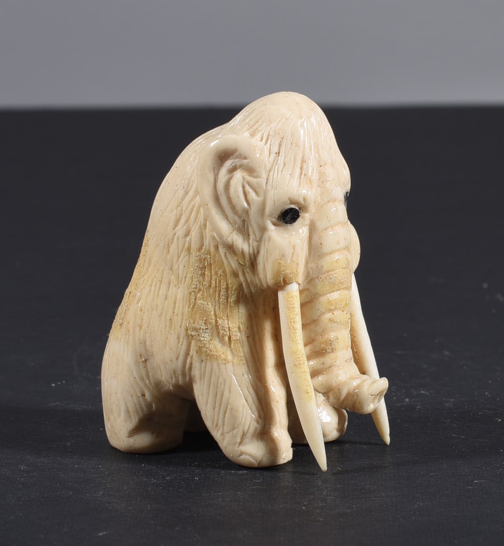 Inuit Carved Whale Bone Figure: These bone carvings were found in an attic trunk wrapped in 1960s newspaper. The collection came straight from the attic to our gallery and we unwrapped and photoed. All of these are small under 7". W