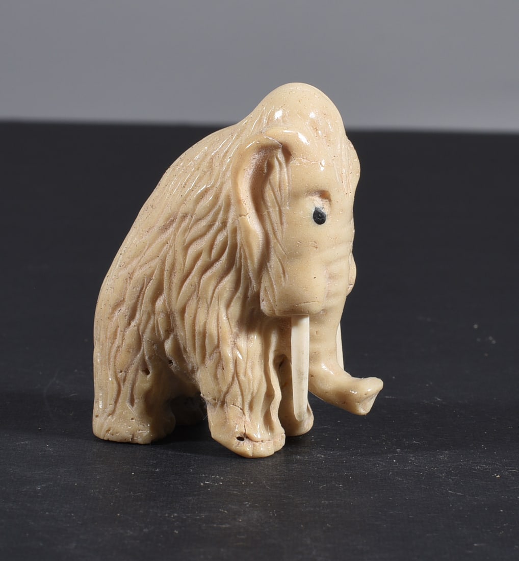 Inuit Carved Whale Bone Figure: These bone carvings were found in an attic trunk wrapped in 1960s newspaper. The collection came straight from the attic to our gallery and we unwrapped and photoed. All of these are small under 7". W