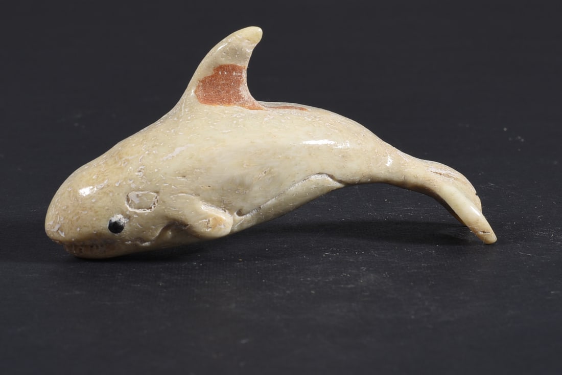 Inuit Carved Whale Bone Figure: These bone carvings were found in an attic trunk wrapped in 1960s newspaper. The collection came straight from the attic to our gallery and we unwrapped and photoed. All of these are small under 7". W