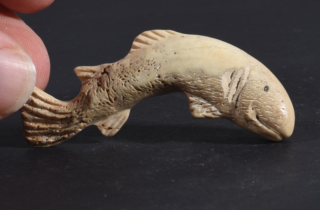 Inuit Carved Whale Bone Figure: These bone carvings were found in an attic trunk wrapped in 1960s newspaper. The collection came straight from the attic to our gallery and we unwrapped and photoed. All of these are small under 7". W