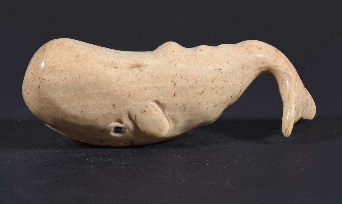 Inuit Carved Whale Bone Figure: These bone carvings were found in an attic trunk wrapped in 1960s newspaper. The collection came straight from the attic to our gallery and we unwrapped and photoed. All of these are small under 7". W