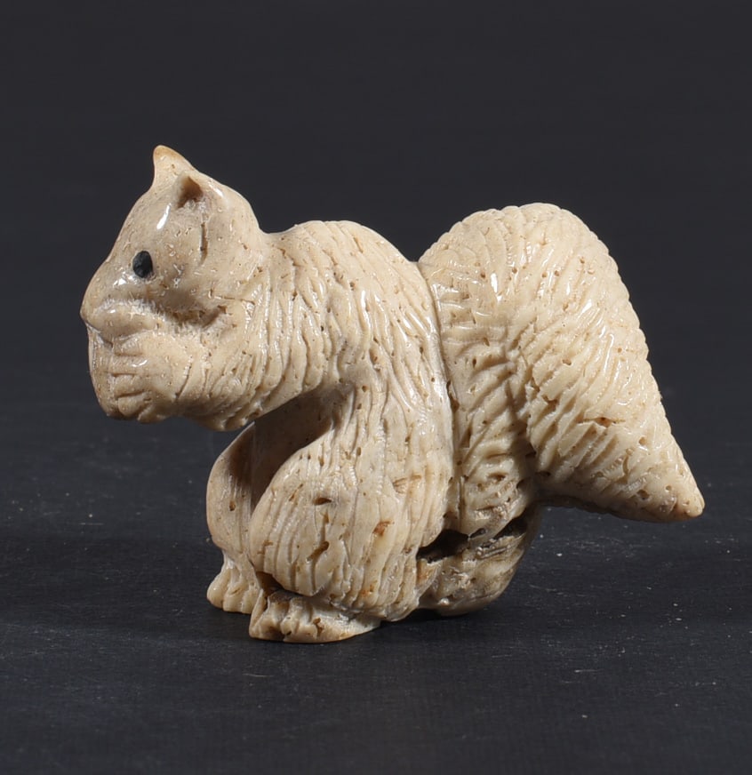 Inuit Carved Whale Bone Figure: These bone carvings were found in an attic trunk wrapped in 1960s newspaper. The collection came straight from the attic to our gallery and we unwrapped and photoed. All of these are small under 7". W