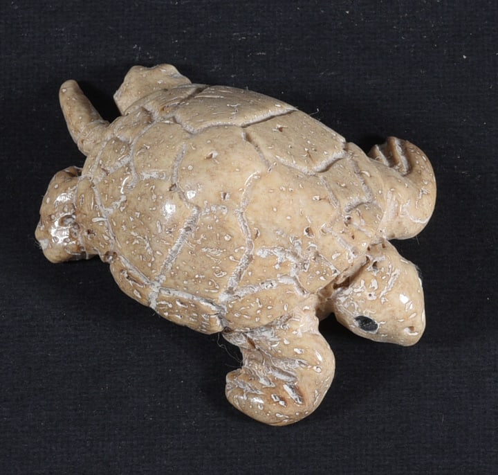 Inuit Carved Whale Bone Figure: These bone carvings were found in an attic trunk wrapped in 1960s newspaper. The collection came straight from the attic to our gallery and we unwrapped and photoed. All of these are small under 7". W