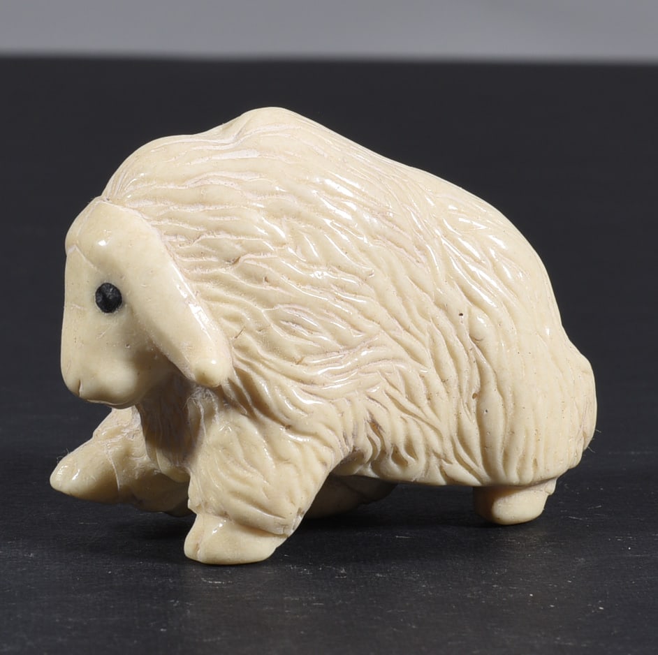 Inuit Carved Whale Bone Figure: These bone carvings were found in an attic trunk wrapped in 1960s newspaper. The collection came straight from the attic to our gallery and we unwrapped and photoed. All of these are small under 7". W