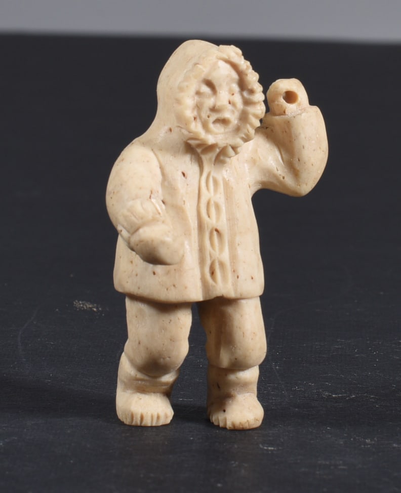 Inuit Carved Whale Bone Figure: These bone carvings were found in an attic trunk wrapped in 1960s newspaper. The collection came straight from the attic to our gallery and we unwrapped and photoed. All of these are small under 7". W