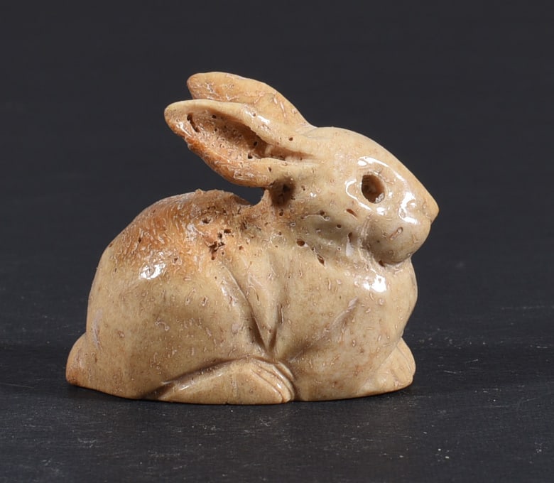 Inuit Carved Whale Bone Figure: These bone carvings were found in an attic trunk wrapped in 1960s newspaper. The collection came straight from the attic to our gallery and we unwrapped and photoed. All of these are small under 7". W