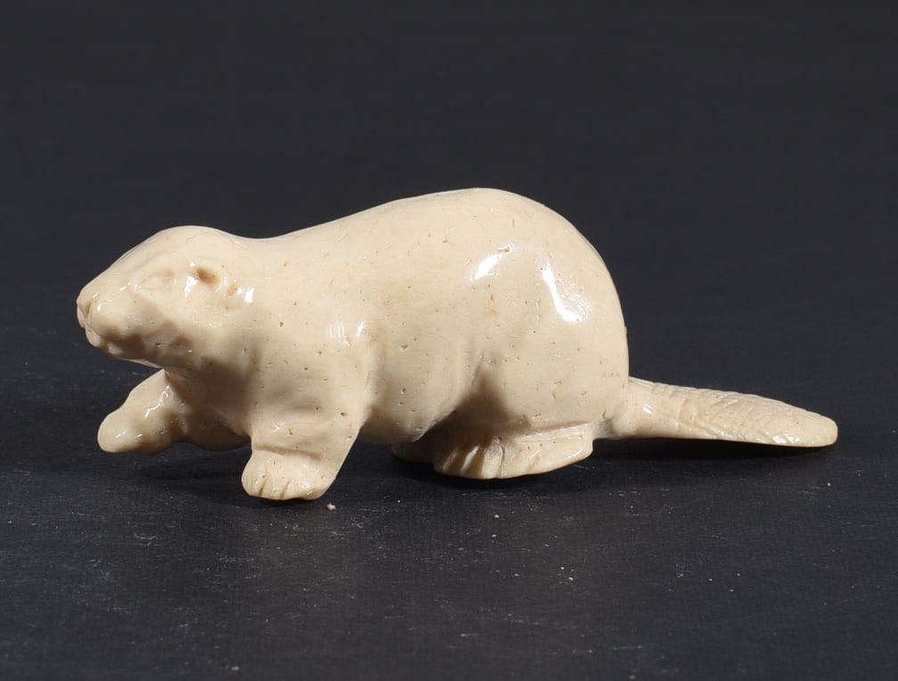 Inuit Carved Whale Bone Figure: These bone carvings were found in an attic trunk wrapped in 1960s newspaper. The collection came straight from the attic to our gallery and we unwrapped and photoed. All of these are small under 7". W